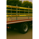 Trailer with fall protection railing and 'Fall Protection Only' tape on a blurred background